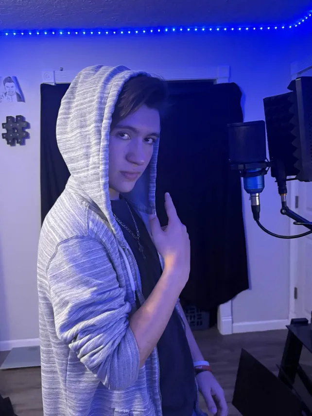 Kellen Marshall in a home studio with microphone